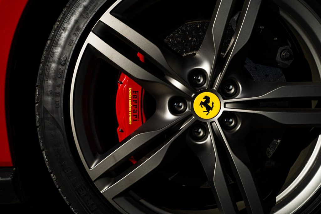 pexels photo 2922140 Detailed view of a Ferrari wheel and brake showcasing luxury automotive design.
