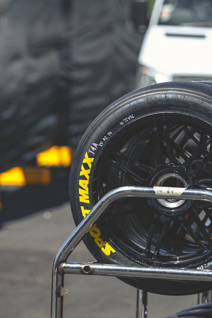 Detailed shot of a racing tire at Mount Panorama motorsport track.